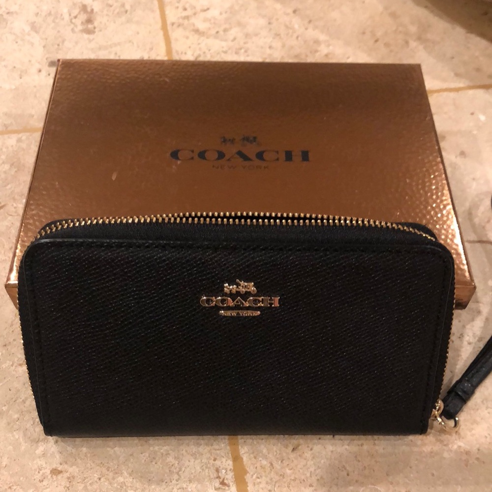 Coach black wristlet.